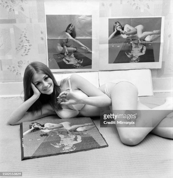 Model girl Jan De Fraine with the jigsaw which has a nude picture of her on each side of the puzzle. The puzzle is marketed with the two pictures...