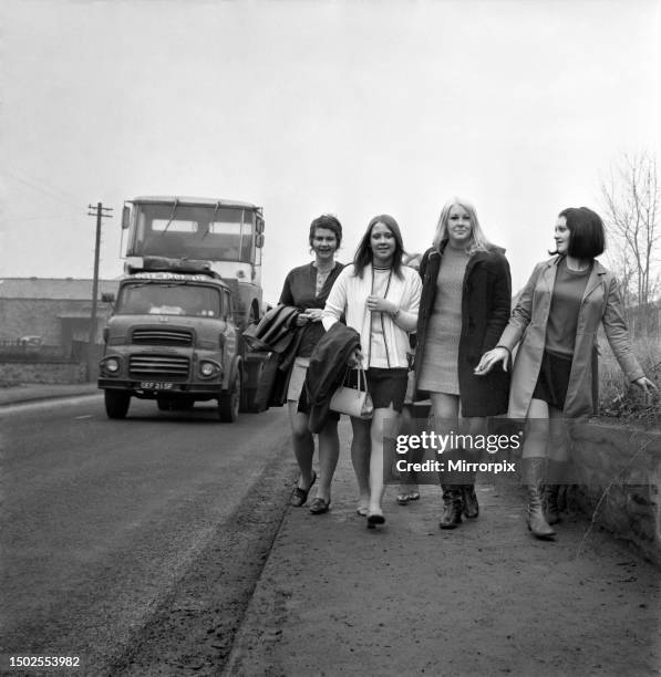 Six of the girls from the barrow printing works near Clitheroe who are threatening to change from mini skirts into maxis because of the mud slashed...