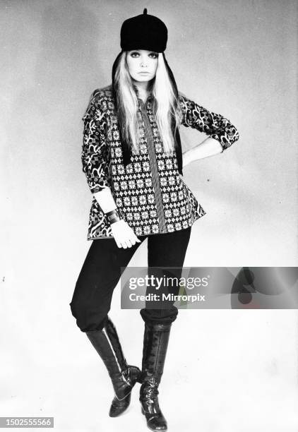 Model posing in tapestry kaftan. Circa 1970.