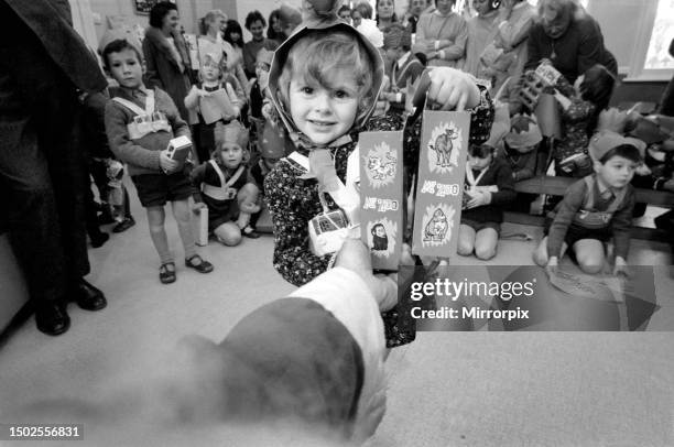 When Father Christmas is on duty handing out toys and gifts to children, children become enraptured with the bewhiskered figure as he chats to them....