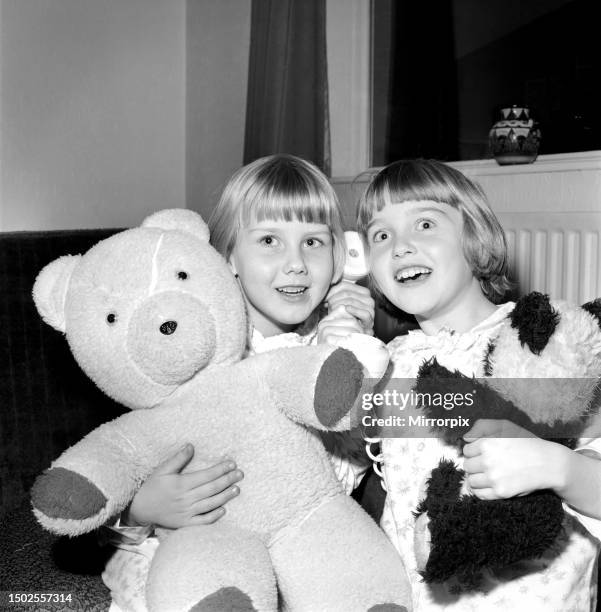 Ailsa and Alison Mackey of Romily, Cheshire, listen in to a bedtime story. December 1969.