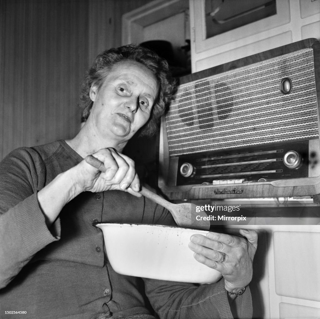 Housewife cooking dinner in her kitchen at home