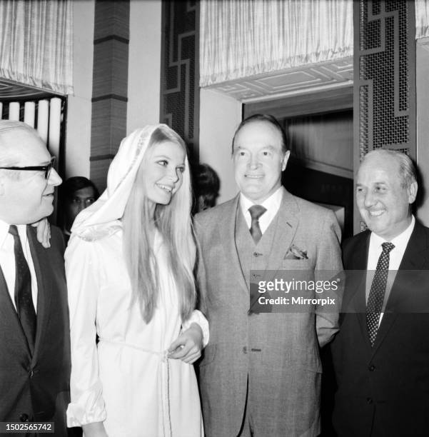 Film actor Bob Hope opens 'How to Commit Marriage' at The New Victoria Theatre. Bob Hope with Eva Rueber-Staier, Miss World. December 1969.