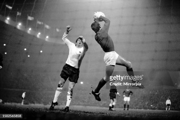 Manchester Utd v Derby County. United goalkeeper Alex Stepney gathers the ball from a high cross foiling Derby forward. 10th December 1969.