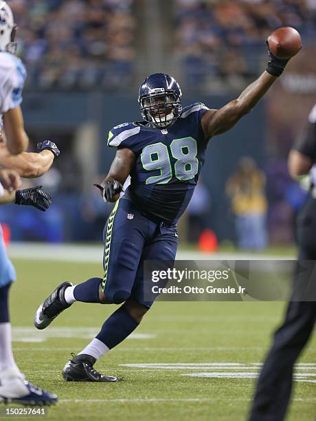 Defensive end Greg Scruggs of the Seattle Seahawks tries to block a pass against the Tennessee Titans at CenturyLink Field on August 11, 2012 in...