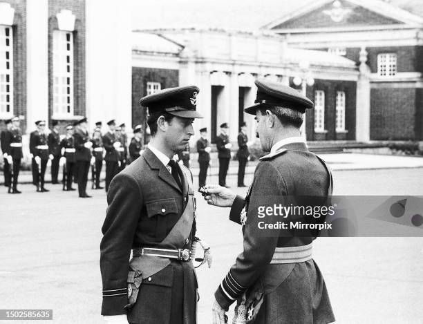 Prince Charles receiving his pilots wings from Air Chief Marshal Sir Denis Spotswood at the RAF College in Cranwell, Lincolnshire August 1971.