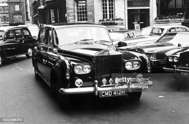 Richard Burton at the wheel of his Rolls Royce in 1970, a present from wife Elizabeth Taylor.