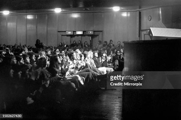 The Rolling Stones performing on stage at the Free Trade Hall, Manchester. The audience cheering and clapping during the show. March 1971.