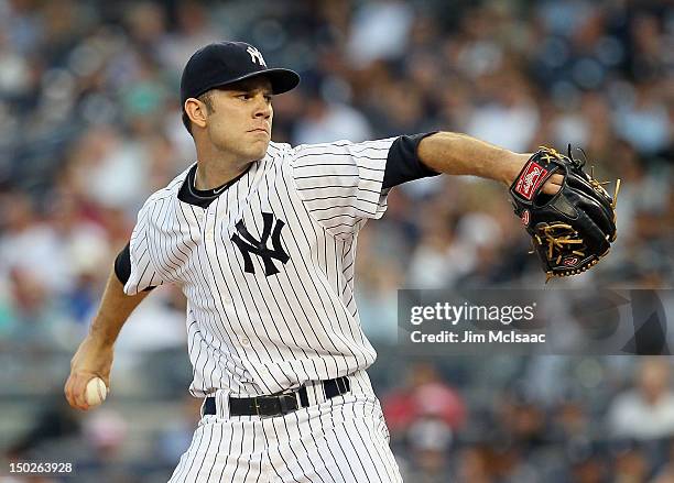 David Phelps of the New York Yankees pitches against the Texas Rangers at Yankee Stadium on August 13, 2012 in the Bronx borough of New York City.