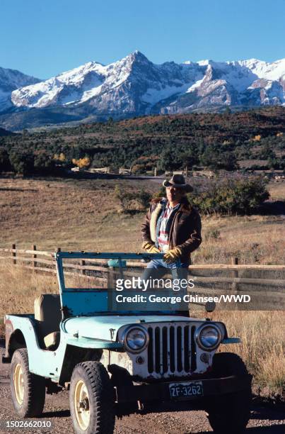 Fashion designer Ralph Lauren is photographed for W Magazine on October 7, 1985 with his 1936 Ford pickup that Lauren bought after seeing a cowboy...