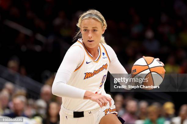 Sophie Cunningham of the Phoenix Mercury dribbles against the Seattle Storm during the first quarter at Climate Pledge Arena on June 24, 2023 in...