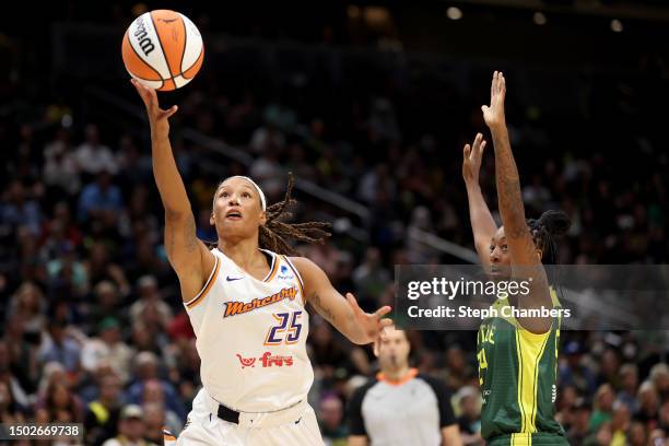 Jennie Simms of the Phoenix Mercury shoots against Jewell Loyd of the Seattle Storm during the first quarter at Climate Pledge Arena on June 24, 2023...