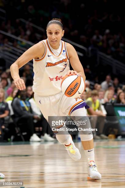 Diana Taurasi of the Phoenix Mercury dribbles against the Seattle Storm during the first quarter at Climate Pledge Arena on June 24, 2023 in Seattle,...