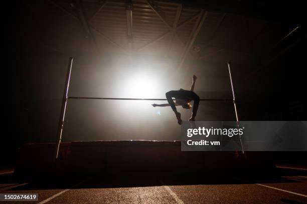 sportswoman silhouette training high jump - high jump stock pictures, royalty-free photos & images