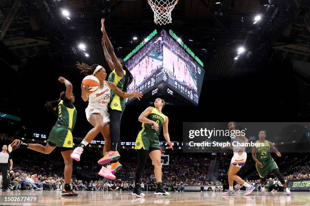 Jennie Simms of the Phoenix Mercury passes against the Seattle Storm during the third quarter at Climate Pledge Arena on June 24, 2023 in Seattle,...