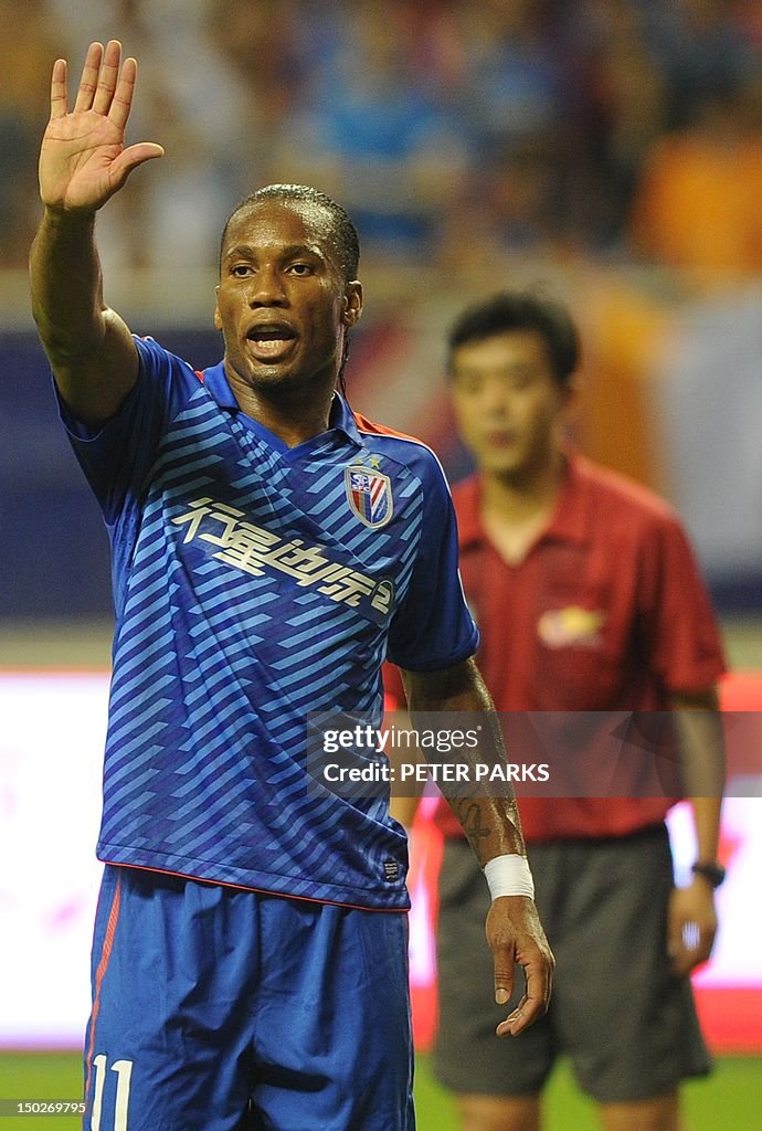 TO GO WITH Fbl-Asia-CHN-Drogba,FOCUS by 