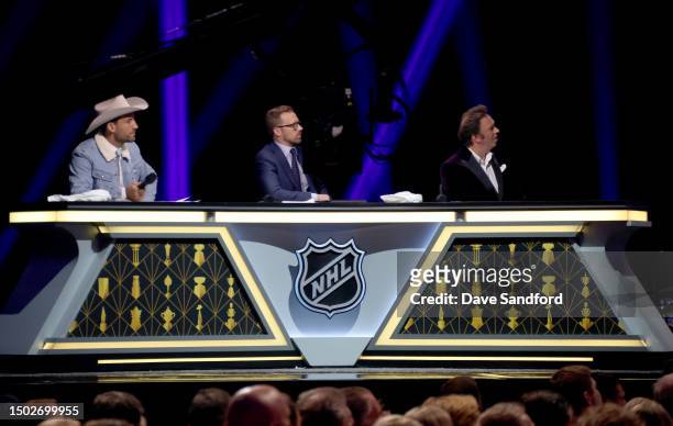 Paul Bissonnette, Liam McHugh and Elliotte Friedman onstage at the 2023 NHL Awards at Bridgestone Arena on June 26, 2023 in Nashville, Tennessee.