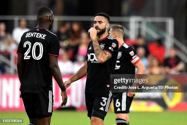 Derrick Williams of D.C. United talks to Christian Benteke of D.C. United during a game between Real Salt Lake and D.C. United at Audi Field on June...