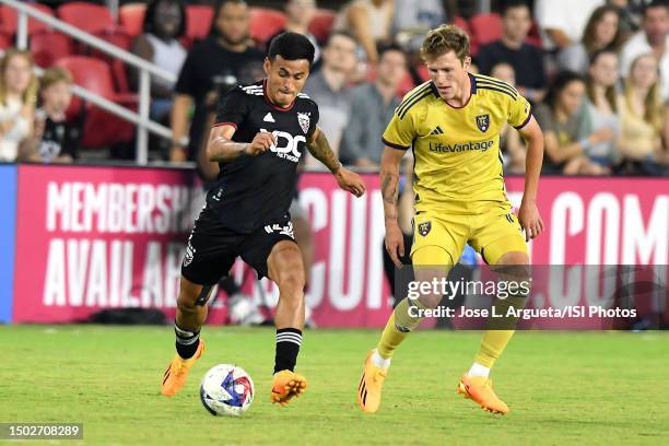 Andy Najar of D.C. United battles for the ball with Bode Hidalgo of Real Salt Lake during a game between Real Salt Lake and D.C. United at Audi Field...