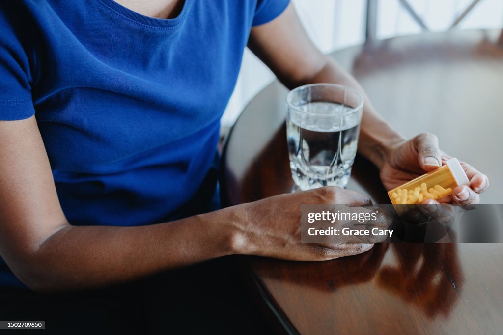 Woman Takes Her Medicine