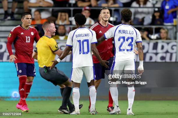Juan Pablo Vargas of Costa Rica exchanges words with Michael Amir Murillo of Panama during the first half of the game at DRV PNK Stadium on June 26,...