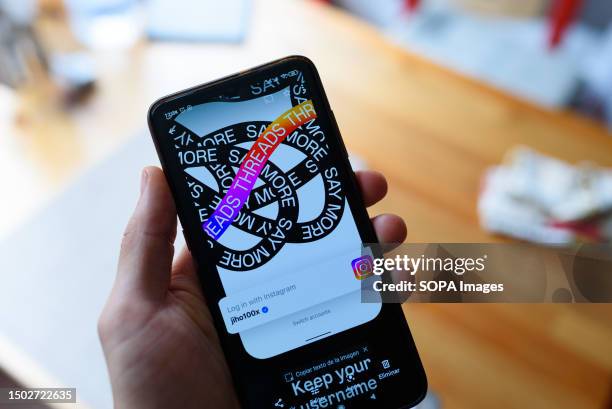 In this photo illustration, the app Threads from Meta seen displayed on a mobile phone. Threads is the latest app launched by Meta, which will be...