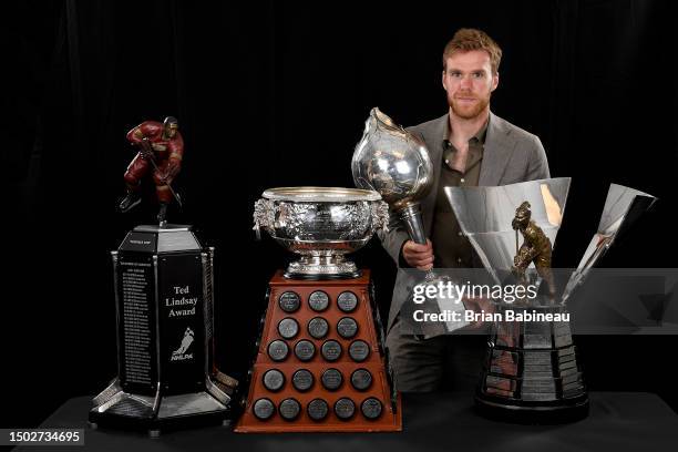 Connor McDavid poses with the Ted Lindsay Award, The Art Ross Trophy, Hart Trophy, and Maurice 'Rocket' Richard Trophy at the 2023 NHL Awards at...