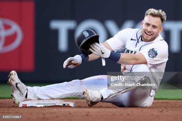 Jarred Kelenic of the Seattle Mariners reacts after his steal of second base, which was initially ruled an out, was overturned during the fifth...