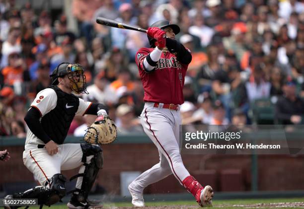 Ketel Marte of the Arizona Diamondbacks hits a two-run home run against the San Francisco Giants in the top of the eighth inning at Oracle Park on...
