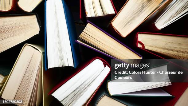 anonymous books mixed seen from above in paris, france - entertainment book edit stock pictures, royalty-free photos & images