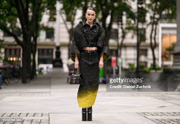 Mary Leest is seen wearing a black Marc Jacobs jacket and black and yellow Marc Jacobs skirt, Marc Jacobs boots and black and gold bag outside the...