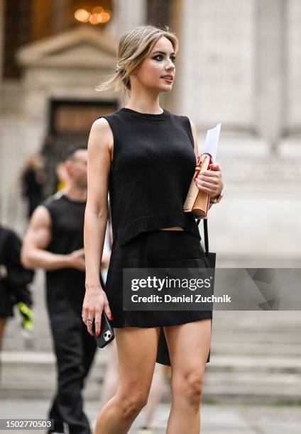 Guest is seen wearing a black sleeveless top and black skirt outside the Marc Jacobs show on June 26, 2023 in New York City.
