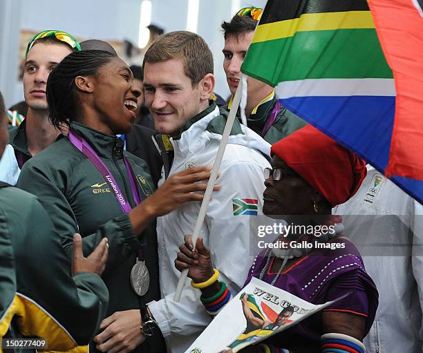 Medal winners Caster Semenya shares a joke with Cameron van der Burgh share as her grandmother Mmabuthi Segale looks on during the South African...