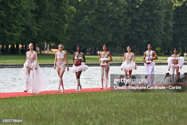 Models and Gigi Hadid walk the runway during "Le Chouchou" Jacquemus' Fashion Show at Chateau de Versailles on June 26, 2023 in Versailles, France.