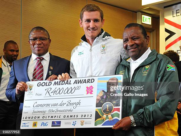 Medal winner Cameron van der Burgh poses with Fikile Mlalula and Gideon Sam during the South African Olympic team arrival and press conference at OR...