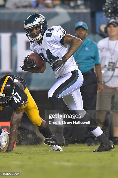 Jamel Hamler of the Philadelphia Eagles evades Myron Rolle of the Pittsburgh Steelers and runs for a touchdown at Lincoln Financial Field on August...