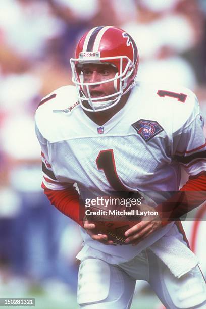 Jeff George of the Atlanta Falcons looks to hand off the ball during a football game against the Washington Redskins on September 25, 1994 at RFK...