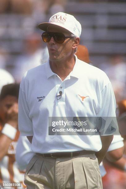 Head coach John Mackovic of the Texas Longhorns looks on before a college football game against the Lousville Cardinals at Memorial Stadium on...