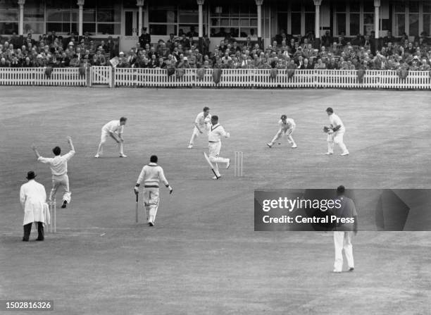 Frank Worrell , right handed batsman from Barbados and the touring West Indies Cricket Team drops his bat after being hit from a delivery by England...