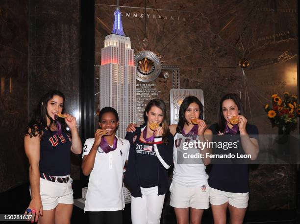 The gold medal-winning US Women's Gymnastics Team, Aly Raisman, Gabby Douglas, McKayla Maroney, Kylas Ross and Jordyn Wieber light The Empire State...