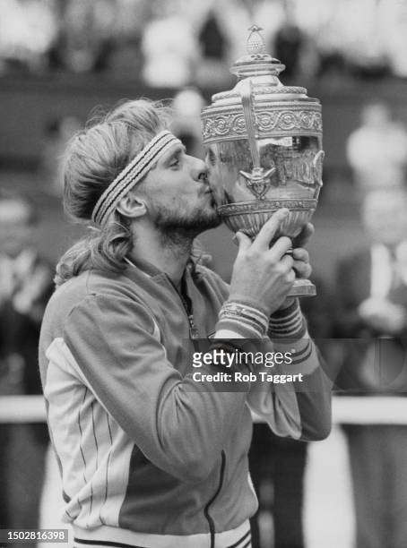 Bjorn Borg from the Sweden kisses the Gentlemen's Singles Trophy after defeating John McEnroe of the United States during the Men's Singles Final...