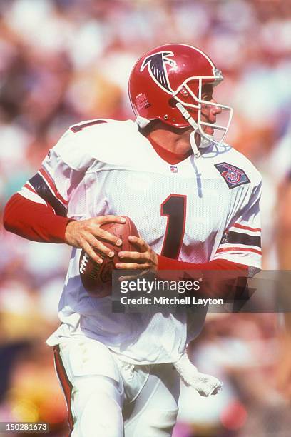 Jeff George of the Atlanta Falcons looks to throw the ball during a NFL football game against the Washington Redskins on September 25, 1994 at RFK...