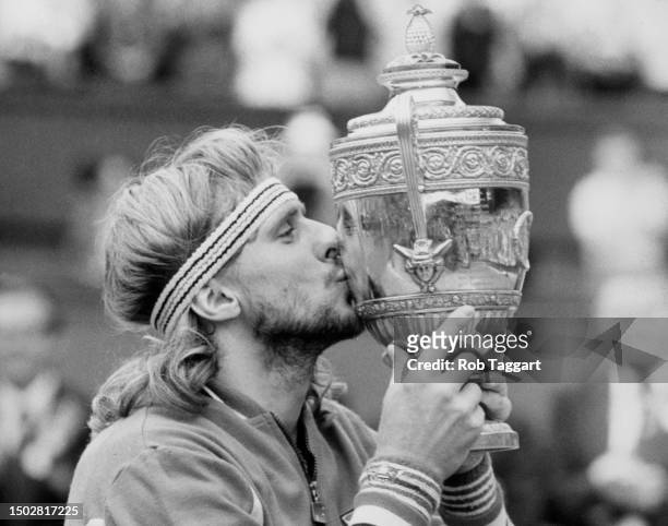Bjorn Borg from the Sweden kisses the Gentlemen's Singles Trophy after defeating John McEnroe of the United States during the Men's Singles Final...