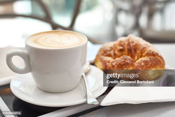 cappuccino and brioche - capuccino fotografías e imágenes de stock