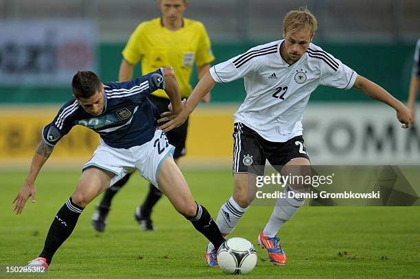 Maximilian Beister of Germany adn Juan Manuel Iturbe of Argentina battle for the ball during the Under 21 international friendly match between...