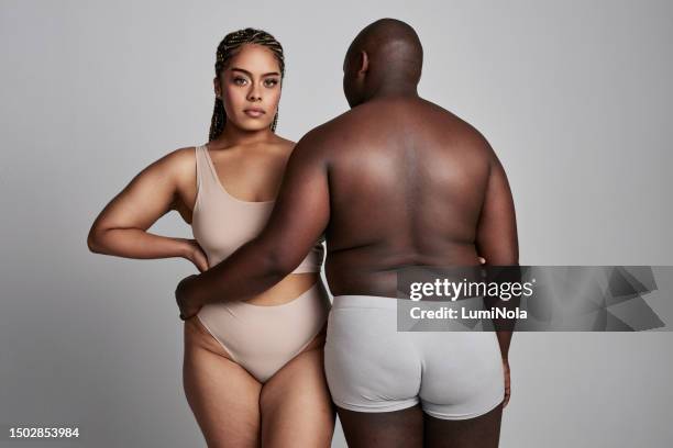 Happy Plus Size And Couple Hug In Studio In Underwear For Wellness Health  And Skincare Natural Beauty And African Man And Woman Embrace On Gray  Background For Body Positivity Care And Love