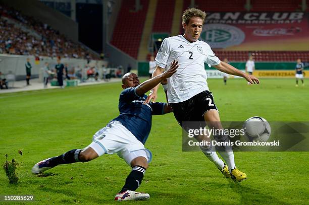 Enzo Beloso of Argentina challenges Oliver Sorg of Germany during the Under 21 international friendly match between Germany U21 and Argentina U21 at...