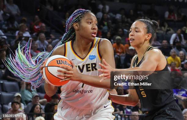 Aliyah Boston of the Indiana Fever passes against Kiah Stokes of the Las Vegas Aces in the fourth quarter of their game at Michelob ULTRA Arena on...