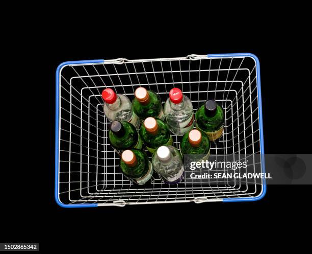 wine bottles in shopping basket - value for money stock pictures, royalty-free photos & images