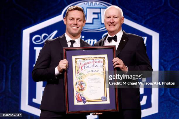 Hall of Fame inductee Sam Mitchell poses with Ricahrd Goyder during the Australian Football Hall of Fame at Crown Palladium on June 27, 2023 in...